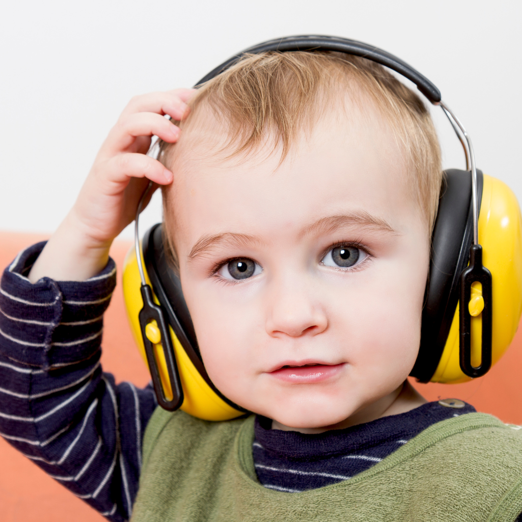 a child wearing yellow headphones