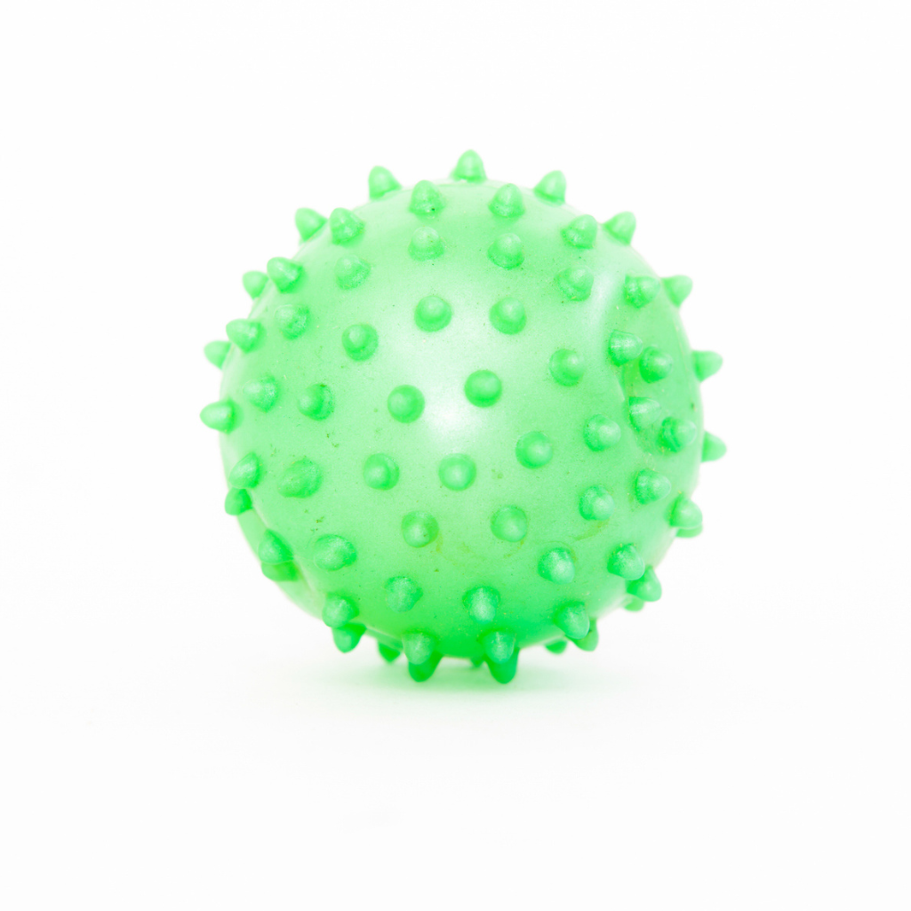 a green ball with spikes